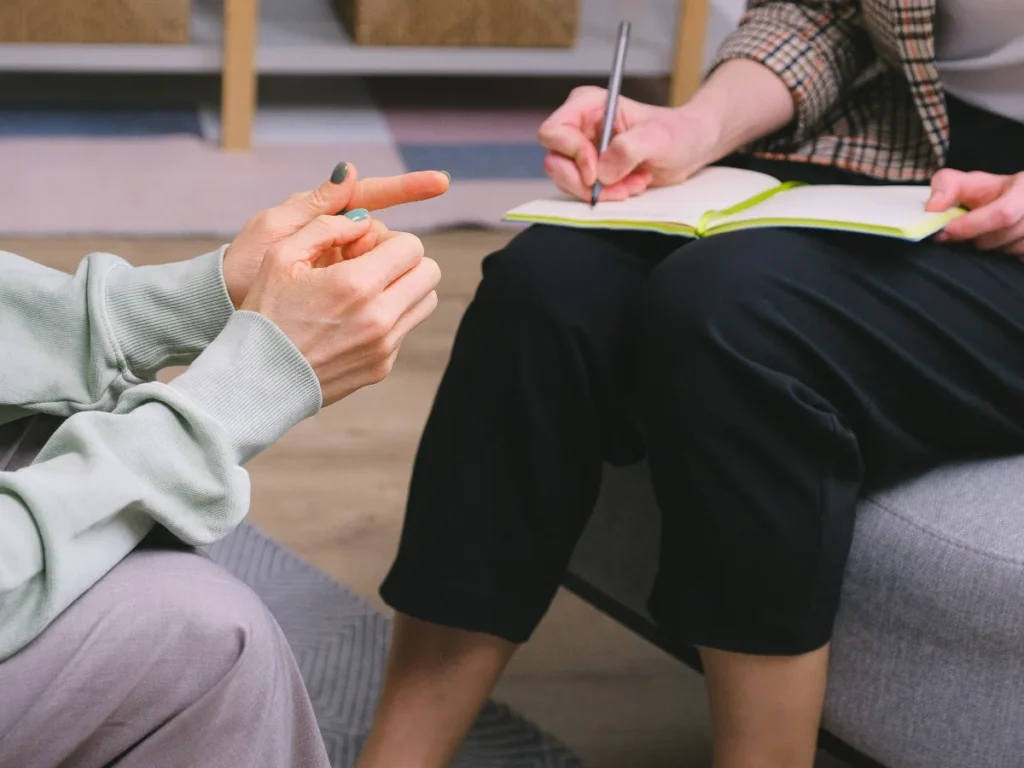 An individual consulting with a counselor as part of a personalized DUI treatment plan, focusing on addressing the root causes of substance abuse for long-term recovery.